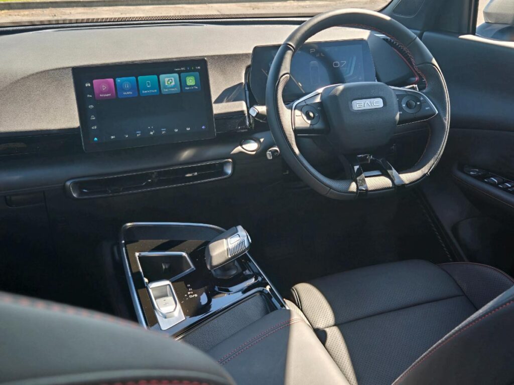 Cockpit showing the large centre touchscreen, steering wheel and dashboard of the BAIC X55 Premium crossover SUV