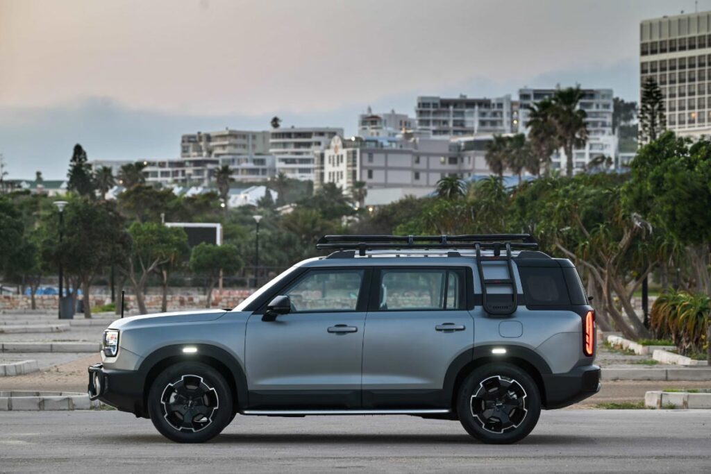 Side view of a matte Platinum Grey BAIC B30 SUV parked t a beachside carpark