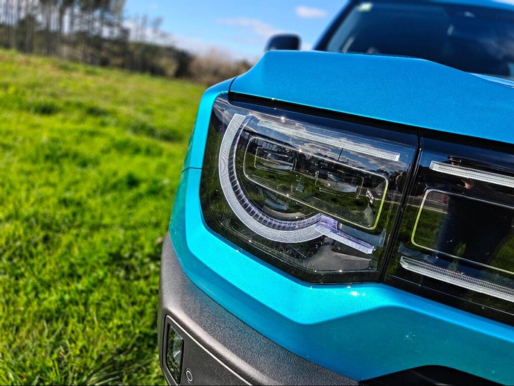 Close up of the front LED headlight of a blue BAIC B30 SUV Premium Adventure Hybrid AWD