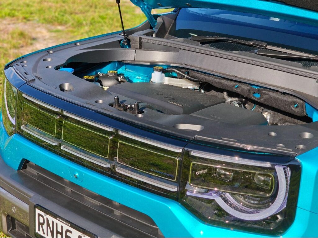 Open bonnet of a blue BAIC B30 looking at the hybrid powertrain