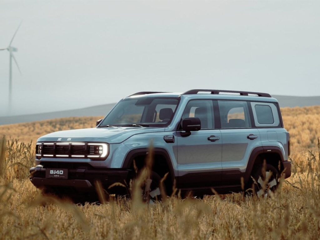 Front three quarter view of a silver BAIC B30 SUV parked in a field
